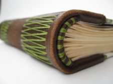 green brown headband on leather spine